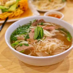 a bowl of soup with meat and vegetables