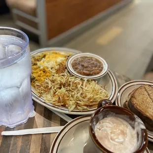 a plate of food and a glass of water