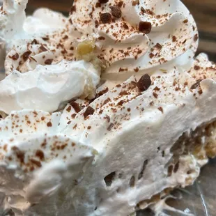 a slice of pie with whipped cream and chocolate sprinkles