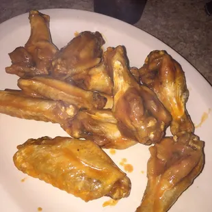 a plate of chicken wings