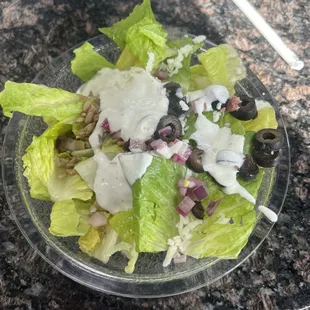 a salad in a plastic bowl