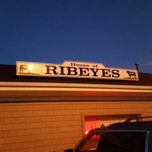 a sign on the roof of a building