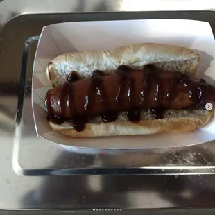 Sausage cooked to perfection and smothered in BBQ sauce
