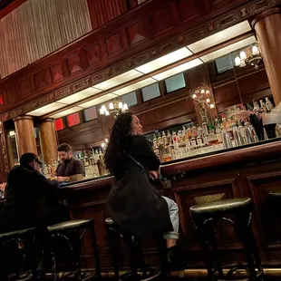 people sitting at a bar