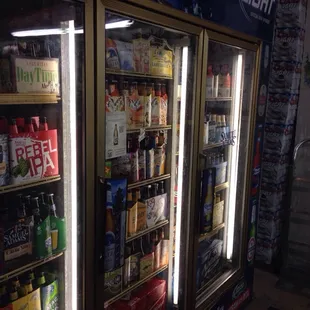 a row of bottles in a refrigerator