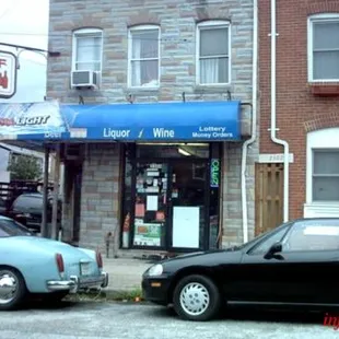 two cars parked in front of a building