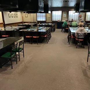 a dining room with tables and chairs