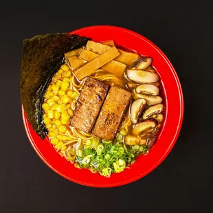 a bowl of ramen and vegetables