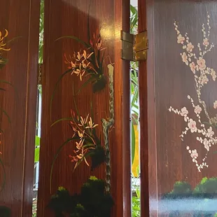 a room divider decorated with flowers