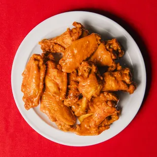 a plate of chicken wings