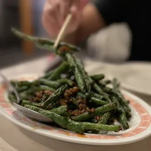 a plate of stir fried green beans