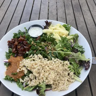 Indian bowl (rice, curry, chutney, jicama, pepitas, and a tzatziki sauce on the side).