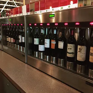 a row of bottles of wine on display