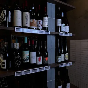 bottles of wine on shelves in a store