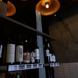 several bottles of wine on a shelf