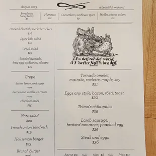 a menu for a restaurant on a wooden table