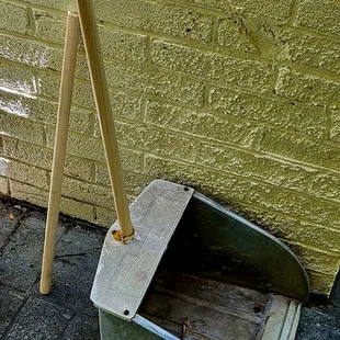 The wooden stick/pole was a bit too long, so I had to cut it down to fit the dust pan.