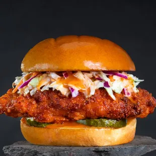 a chicken sandwich with coleslaw