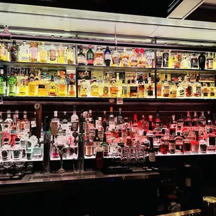 a bar filled with liquor bottles