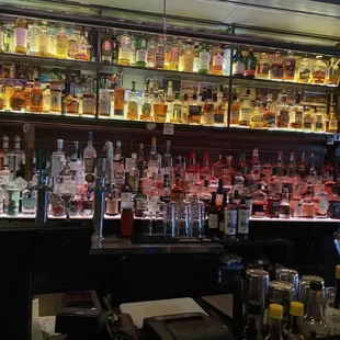 a bar filled with liquor bottles