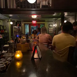 people sitting at a bar