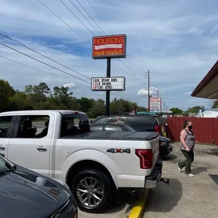 a woman walking towards a truck
