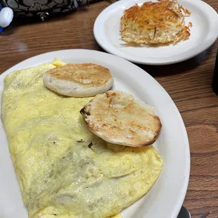Bacon omelet and crispy hash browns.