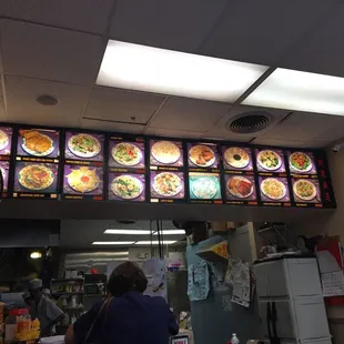 a woman standing in front of a restaurant