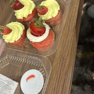 Strawberry lemon cupcakes and one strawberry cheesecake cupcake.