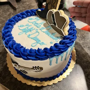 a hand holding a cookie