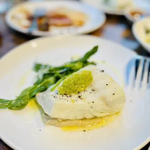 Halibut with fennel brodo, asparagus, English peas and favs beans. So light and fluffy!