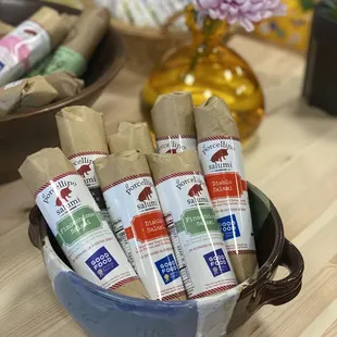 Curated food and beverages. Salami, local cheese, truffle hot sauce, charcuterie boards ingredients.