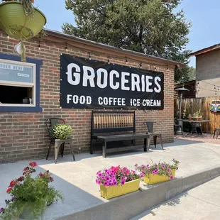 The front of the store. You can go in the store or the walk up to the window. There are a few places to eat outside.