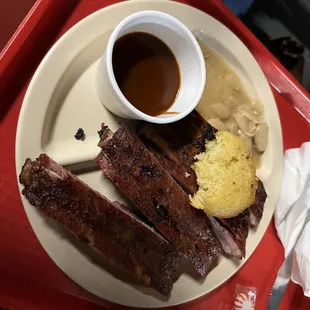 Ribs, bbq sauce, corn bread and white beans.  Excellent.