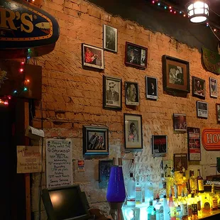 a bar with a brick wall