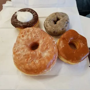 Vanilla cream chocolate glazed, blueberry cake, texas sized glazed, caramel glazed