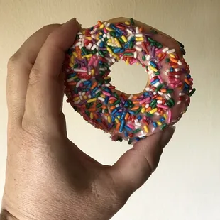Little pink donut with sprinkles.