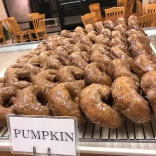 a display of pumpkin doughnuts