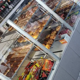 a display case filled with donuts