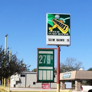 a gas station with a truck parked in front of it