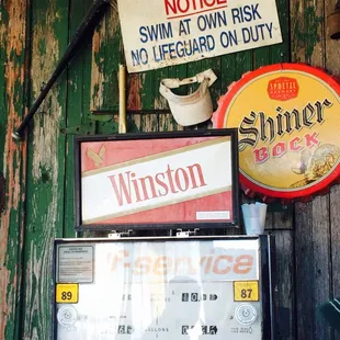 signs on a wooden wall