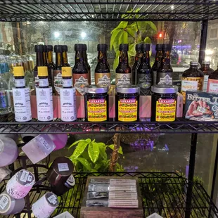 a shelf full of bottles of alcohol
