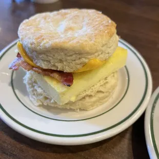 a biscuit with eggs and bacon