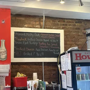 a menu on a brick wall