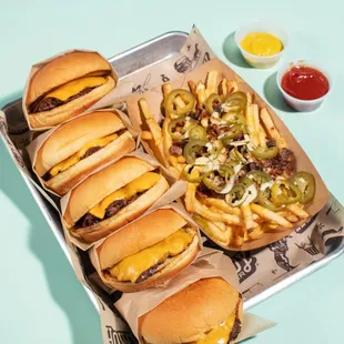 a tray of hamburgers and fries