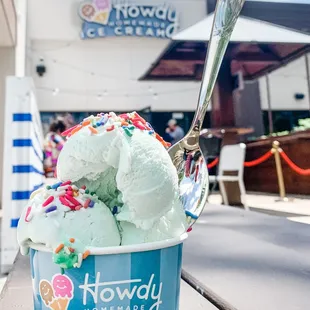 a cup of ice cream with sprinkles