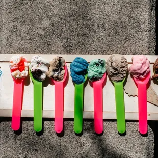 a row of ice cream spoons