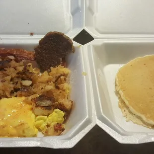 Sausage, eggs, hashbrowns with a pancake