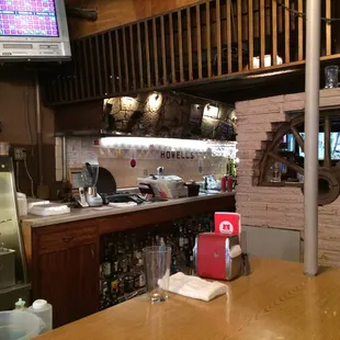 Howell&apos;s in the background, closer to the bar area.