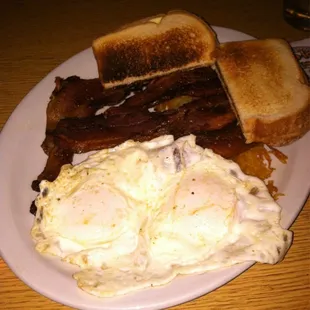 Eggs &amp; bacon w/ hash browns and toast.